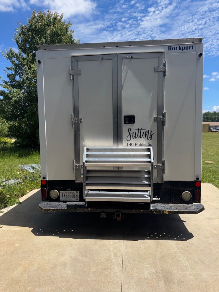 TrailerSteps rear-entry steps installed on a Rockport trailer